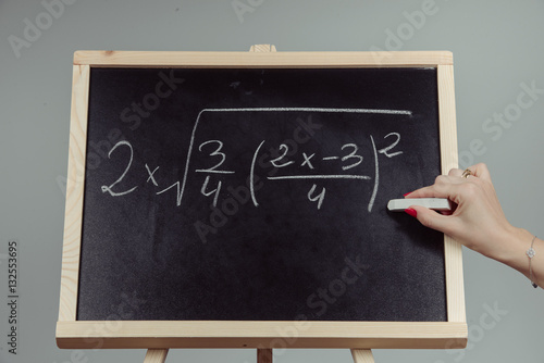 Math exercise on chalkboard