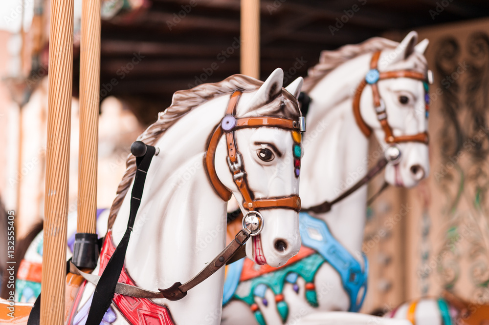 Carousel at a carnival or festival. Decorative ornate horse at a fun fair. Carousel at a carnival or festival. Decorative ornate horse at a fun fair.