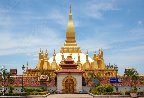 The golden pagoda wat Phra That Luang in Vientiane. Buddhist temple. Famous tourist destination in Asia. (Laos travel landmark)