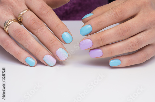 Amazing manicure and natural nails with gel polish. Attractive modern nail art design.