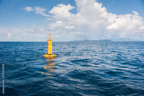 Yellow Sea Buoy in blue Sea at Andaman Sea, Thailand