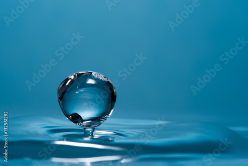 High speed macro from a waterdrop  splashing back again in the water  creating figurine like glass sculptures.