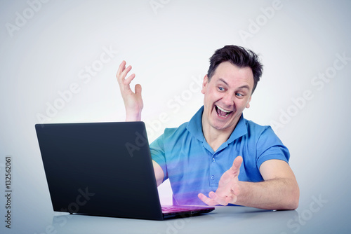Happy man with laptop computer