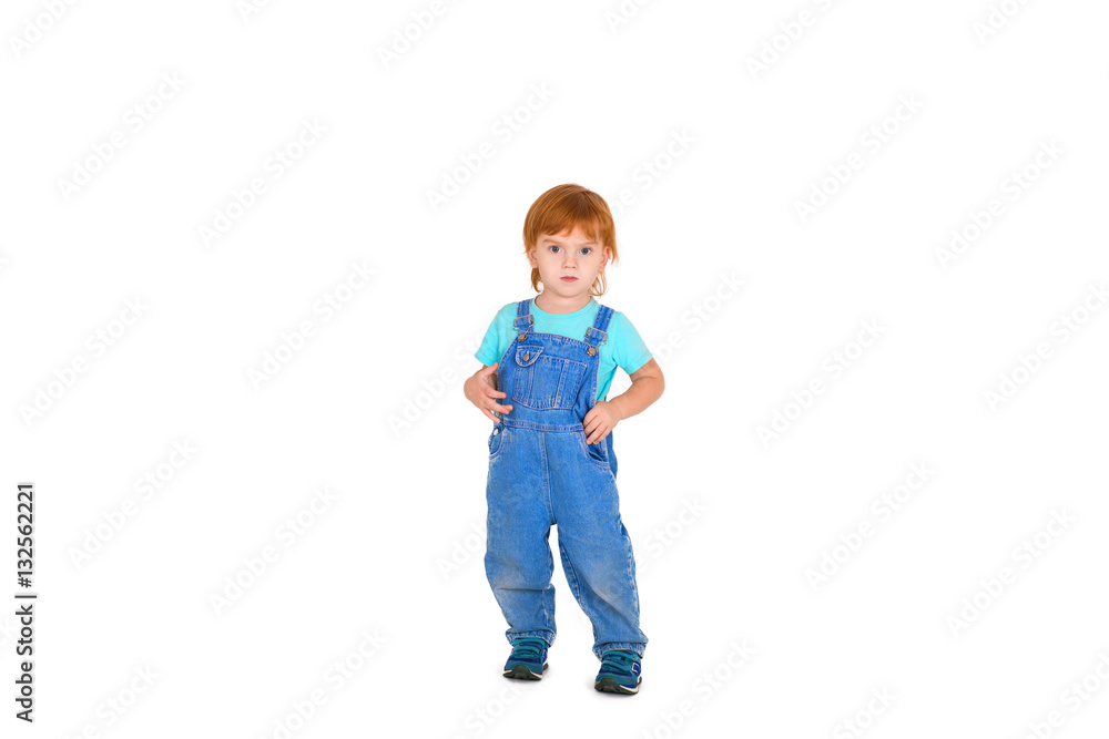 the serious little boy with red hair stands the serious little boy with red hair stands