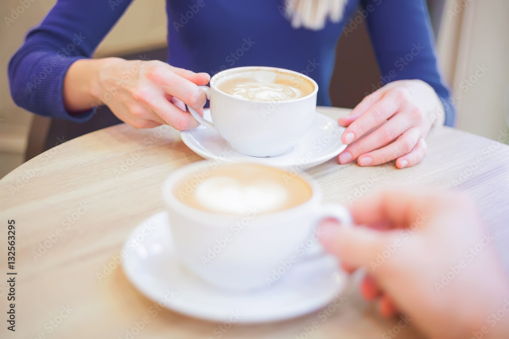 close photographed two drink coffee in a cafe is not visible persons close photographed two drink coffee in a cafe is not visible persons