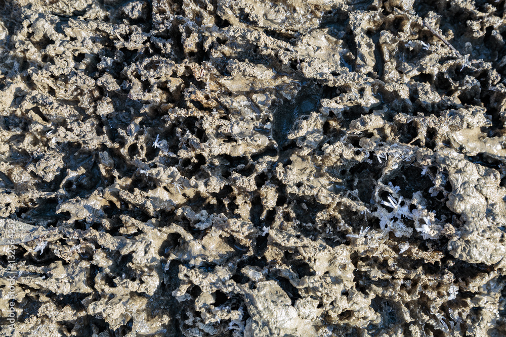 Fototapeta premium Texture of frozen sand covered with snow