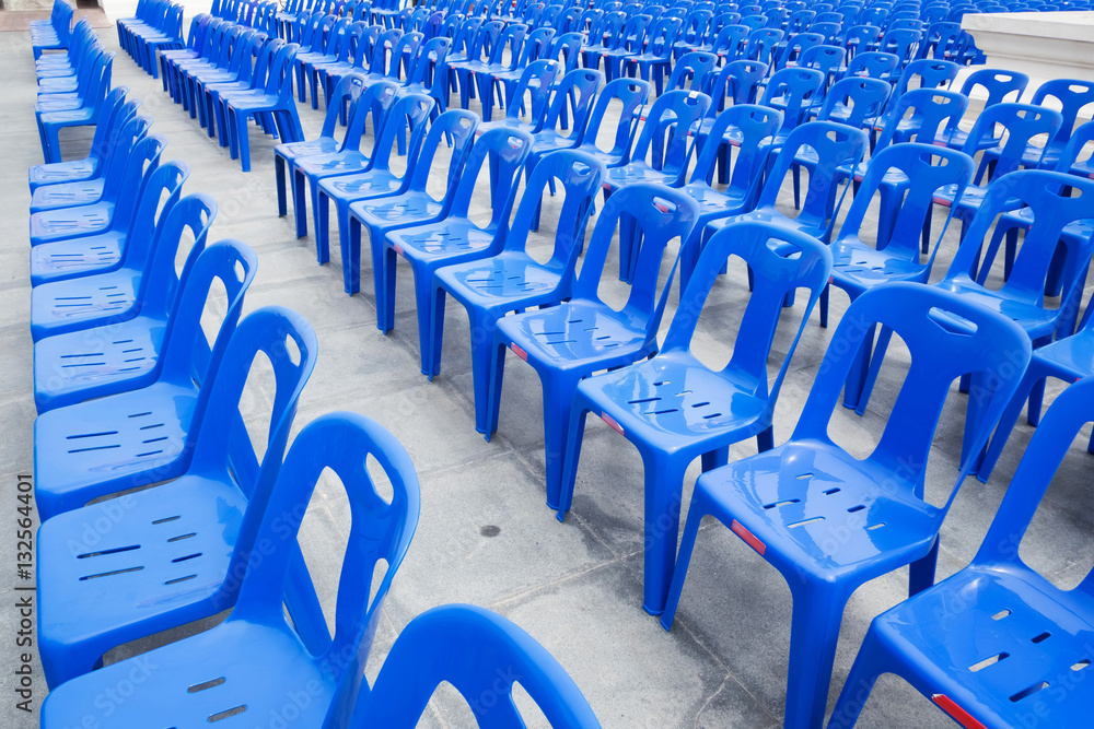 Many blue chairs on the concrete floor for viewing entertainment. Many blue chairs on the concrete floor for viewing entertainment.