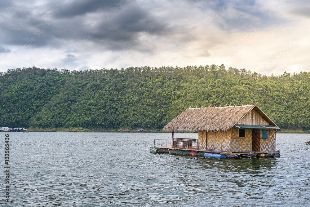 Raft house on green water in natural with soft light. Raft house on green water in natural with soft light.
