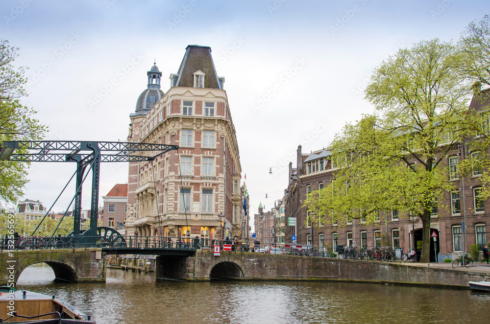 Urban landscape in Amsterdam, Netherlands, Europe. Channels brid
