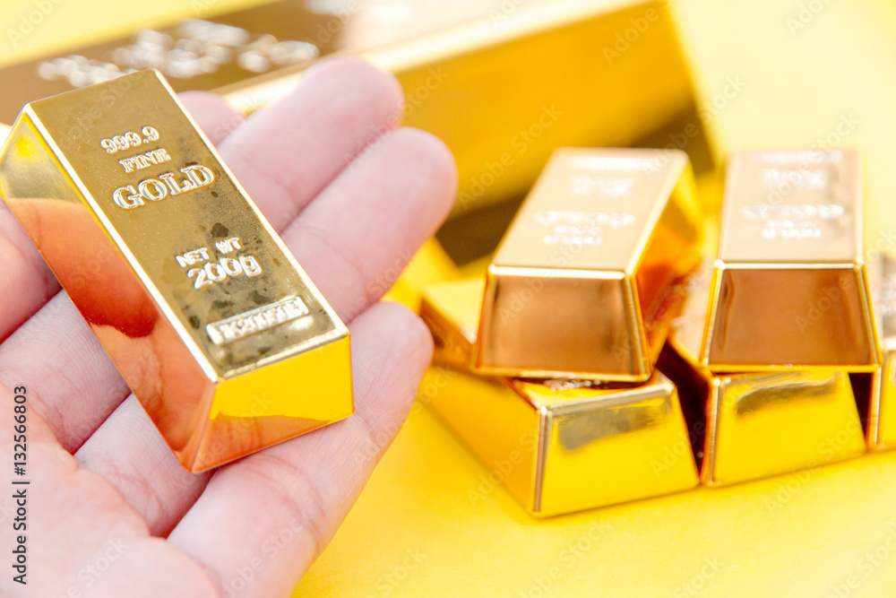 Hand hold gold bars Hand hold gold bars
