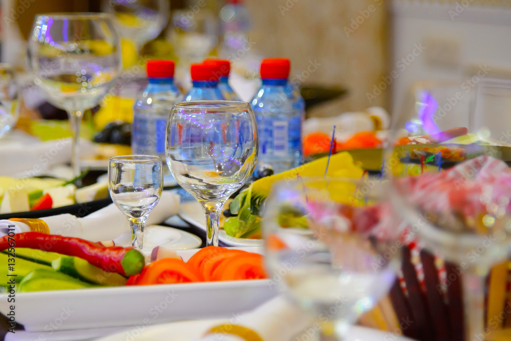 Table and lots of food at the festival. Serving meals at the Banquet. A plentiful feast at the party.