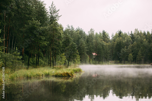Fototapeta Naklejka Na Ścianę i Meble -  A Forest lake in the morning fog