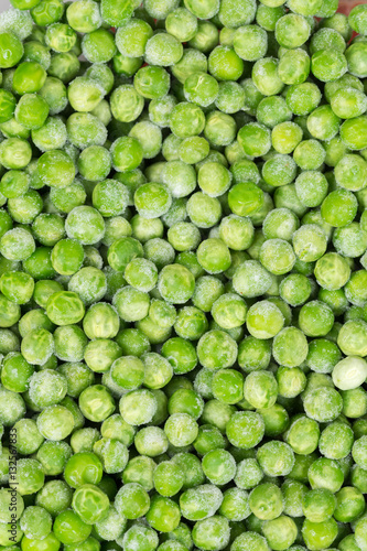 Frozen green peas flat lay background