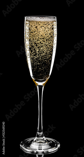 glass of champagne isolated on black background, close up