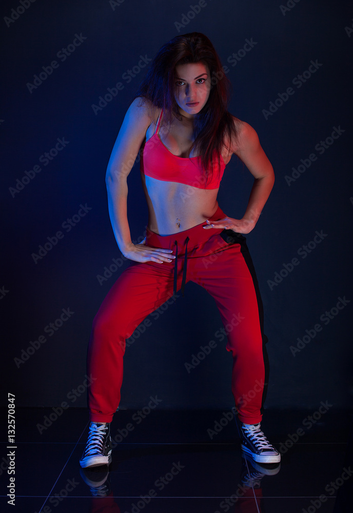 Funk dance workout. Portrait of young sporty woman in motion. Funk dance workout. Portrait of young sporty woman in motion.