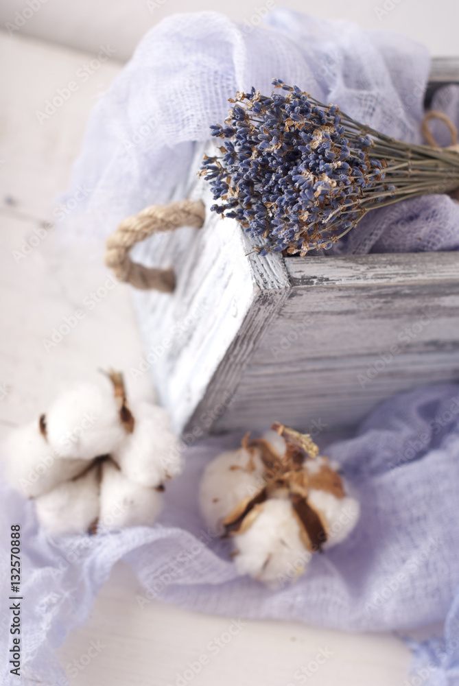 lavender and cotton with violet textile on white wooden table. s lavender and cotton with violet textile on white wooden table. s