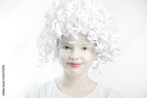 Portrait of a funny teen girl with white and plain makeup and cu © Tseytlin