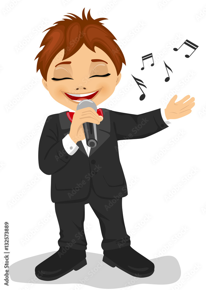 Little boy in black tuxedo with microphone sings a song. Isolated on