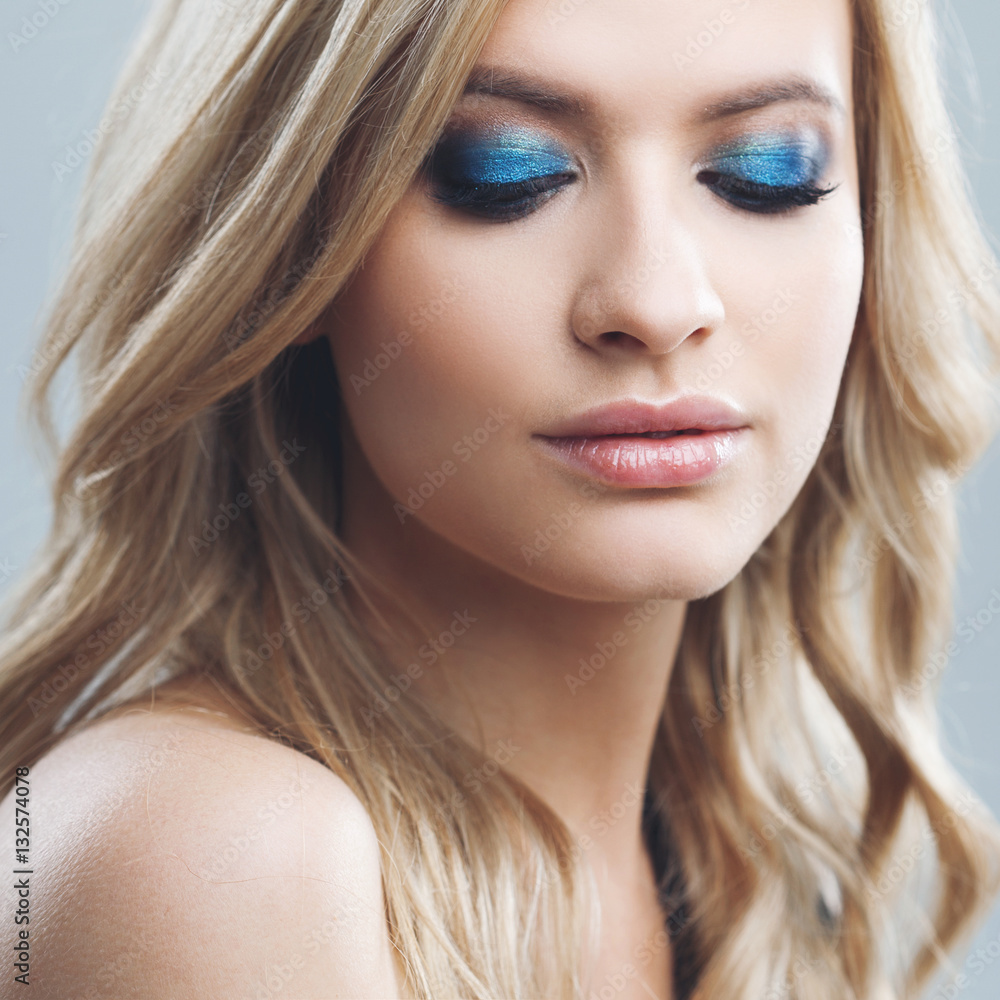 Young and attractive blonde girl with shiny wavy hair . Beautiful model, curly hairstyle . Young and attractive blonde girl with shiny wavy hair . Beautiful model, curly hairstyle .