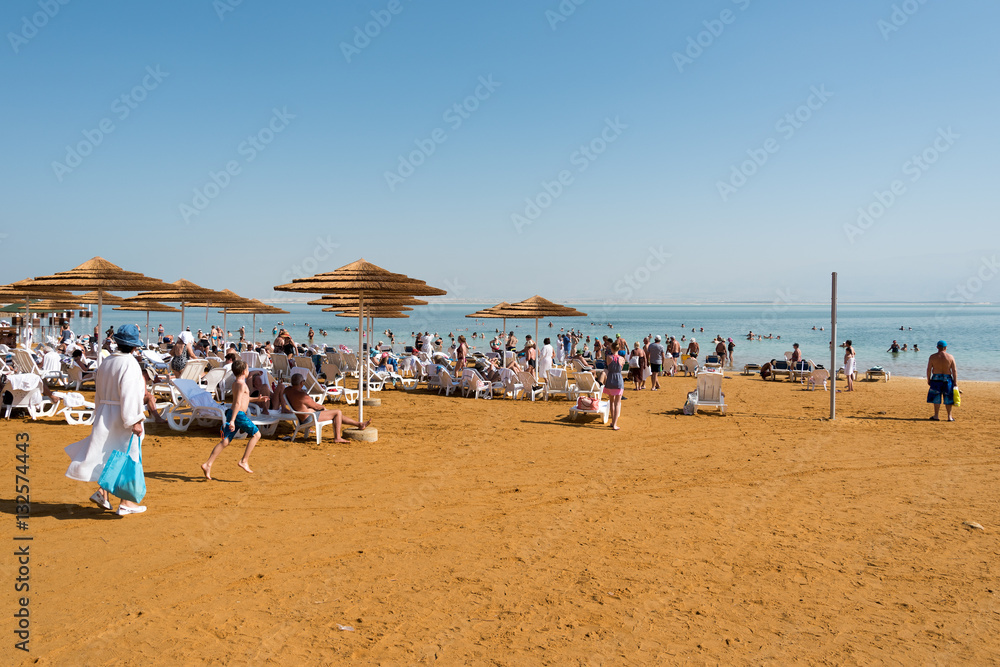 Tourists by Dead sea, Ein Bokek, Israel.