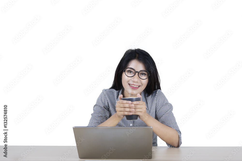 Businesswoman with mug and laptop on studio Businesswoman with mug and laptop on studio