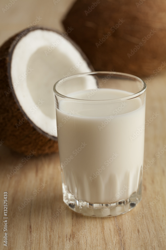 Coconut with s glass of coconut milk Coconut with s glass of coconut milk