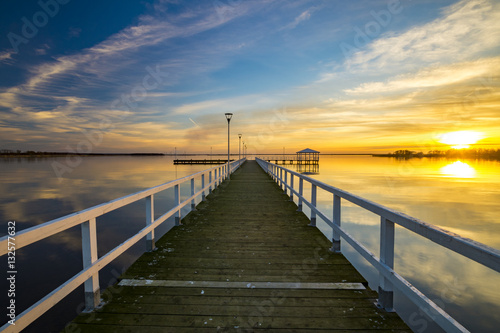 wooden pier on the lake, sunset © Mike Mareen