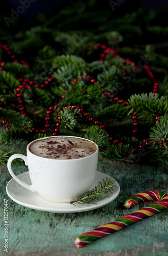 Wallpaper Mural A cup of coffee on a wooden background. Coffee cappuccino with Christmas decorations and fir branches on the old wooden background. Cocoa Cappuccino Coffee Cup of coffee Wooden background Torontodigital.ca