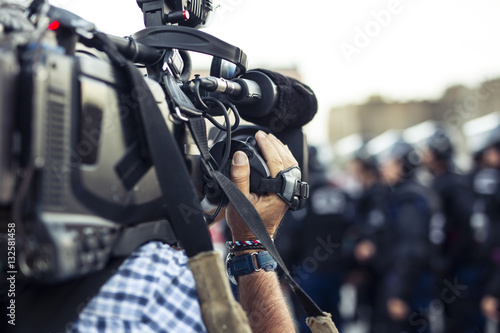 the cameraman captures the events on the streets live television