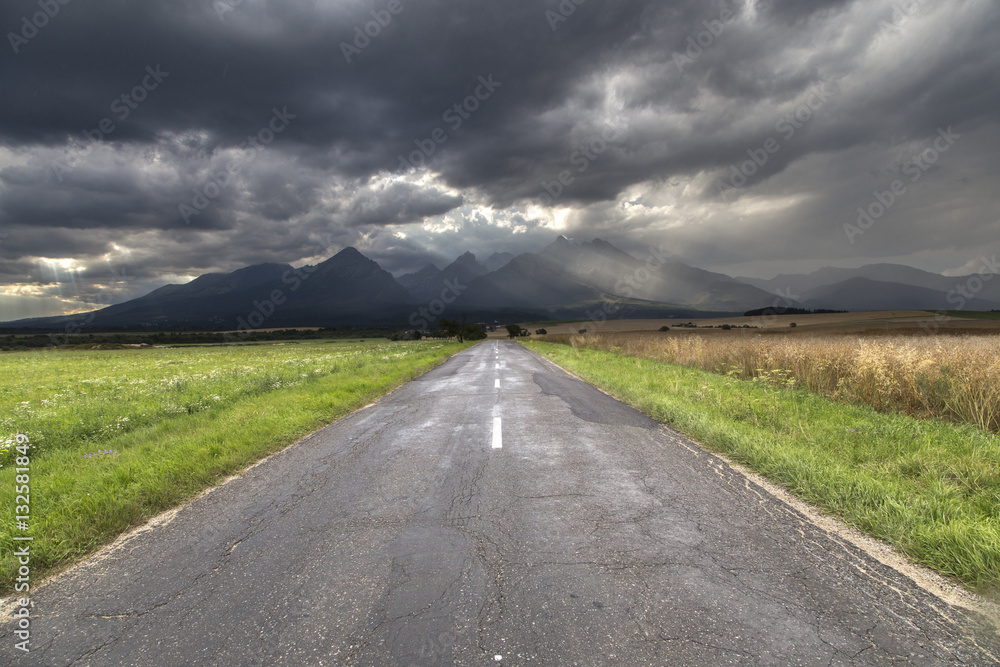 road to high Tatras with dramatic sky