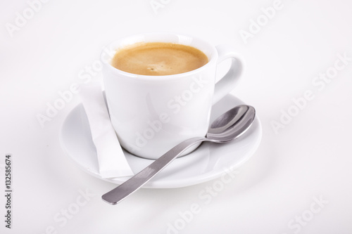 white cup of coffee with spoon