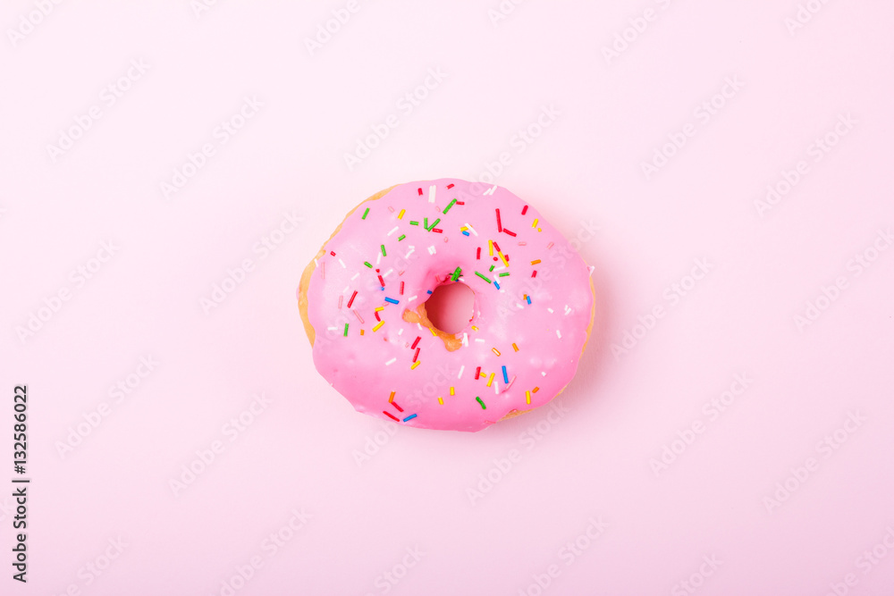 Pink round donut on pastele background. Flat lay, top view. Pink round donut on pastele background. Flat lay, top view.