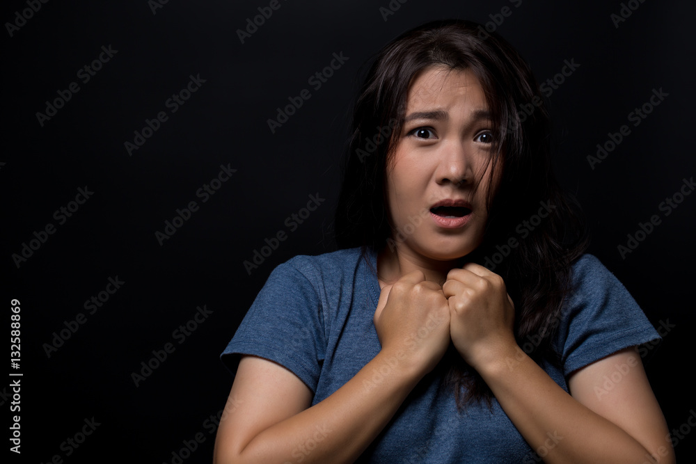 Shocked woman on isolated black background Shocked woman on isolated black background