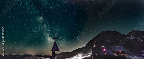 night panorama of milky way over the church under the Triglav peak