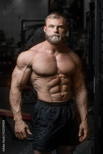 brutal muscular man with beard unshaven fitness model healthcare