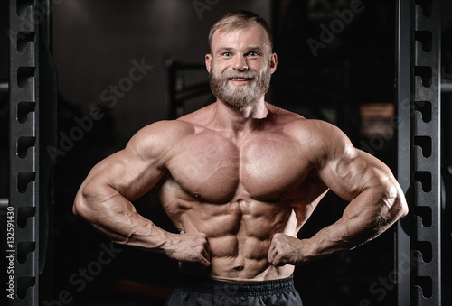 brutal muscular man with beard unshaven fitness model healthcare
