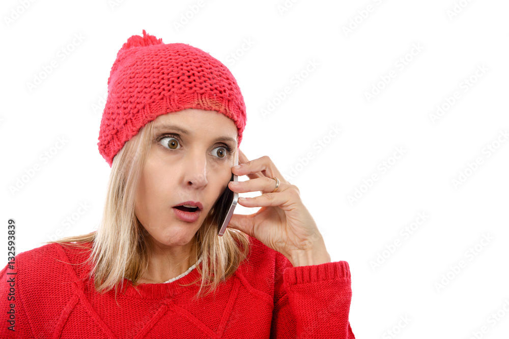 Beautiful young blonde woman with a red cap, phone Beautiful young blonde woman with a red cap, phone