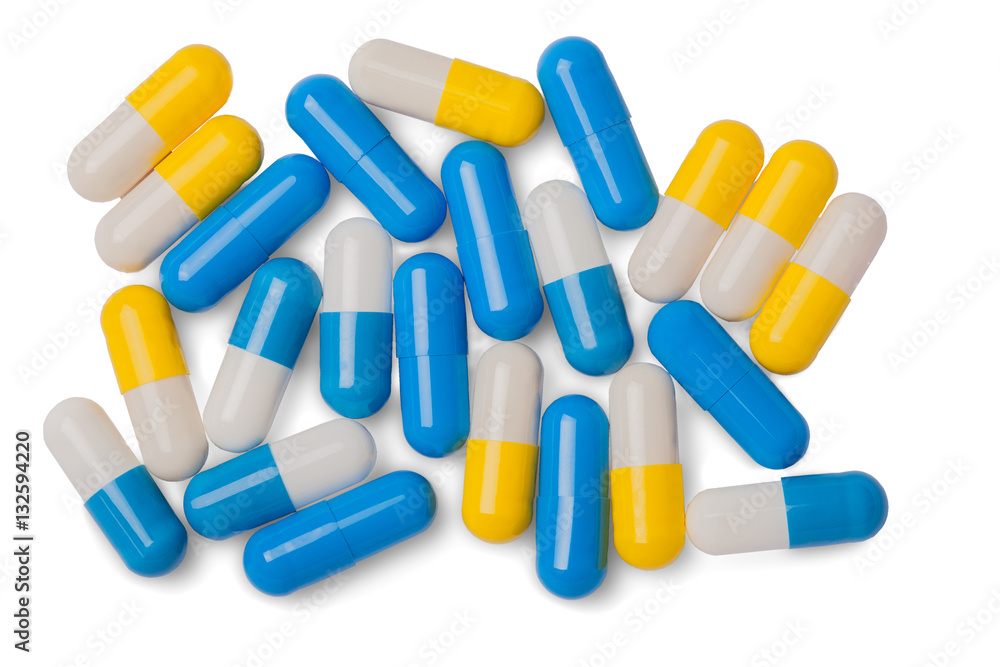 sinii yellow white pills on a white background sinii yellow white pills on a white background