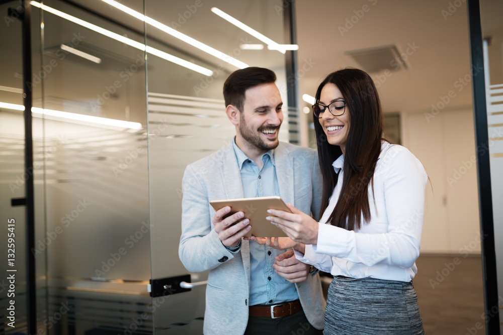 Business colleagues talking at workplace Business colleagues talking at workplace