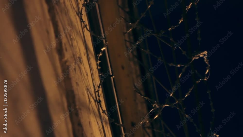 custom made wallpaper toronto digitalLarge fence with barbed wire in the night.