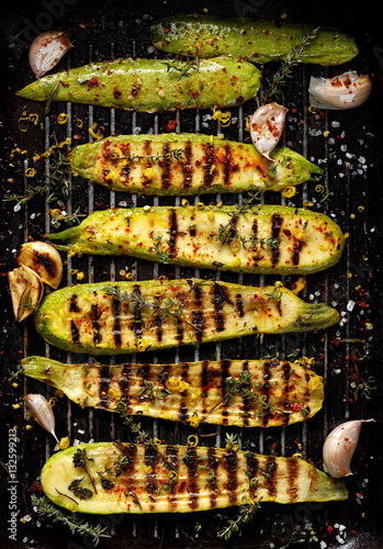 Grilled zucchini with addition of thyme, lemon zest and garlic, top view