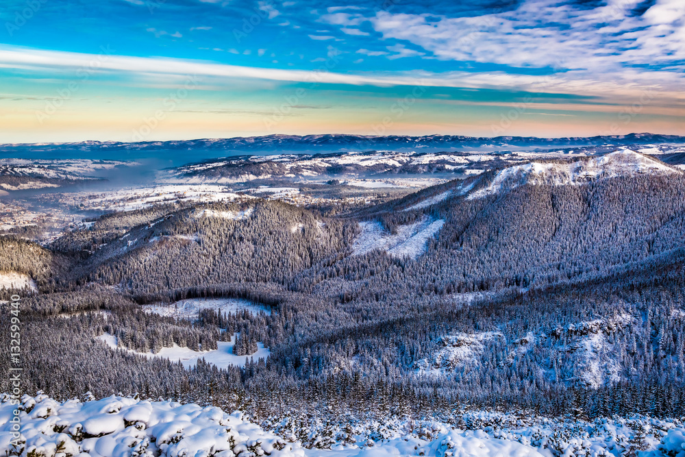 Sunrise over the mountain valley in winter, Poland