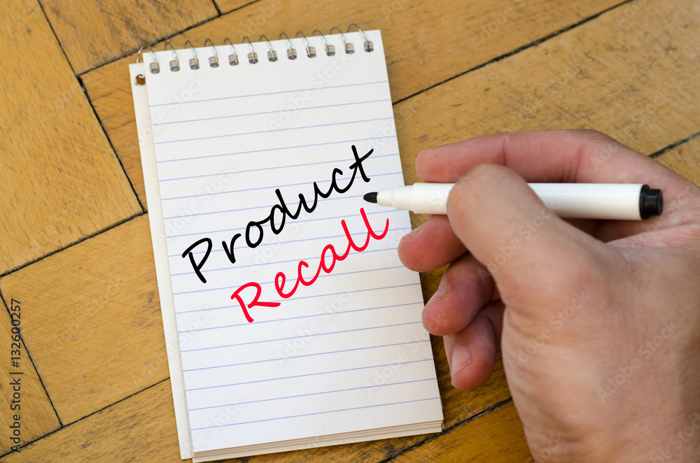 Human hand over wooden background and product recall text concep Human hand over wooden background and product recall text concep