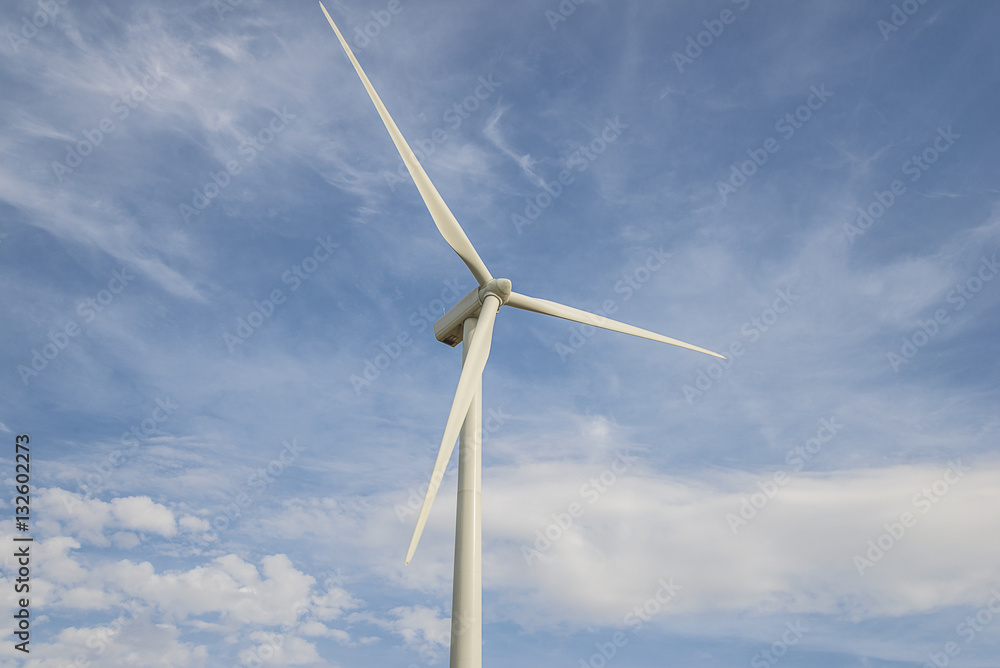 Wind turbine on a blue sky background close up Wind turbine on a blue sky background close up