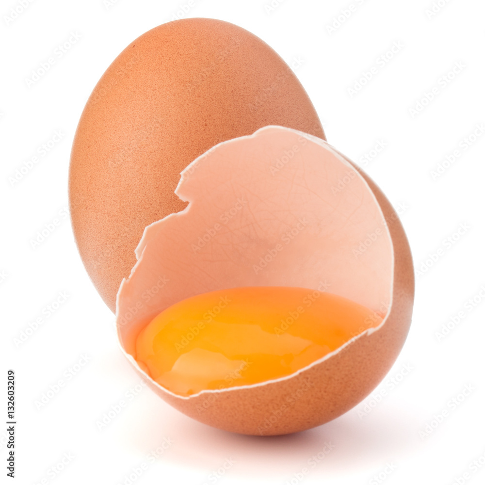 Broken egg in eggshell half and raw egg isolated on white backgr Broken egg in eggshell half and raw egg isolated on white backgr