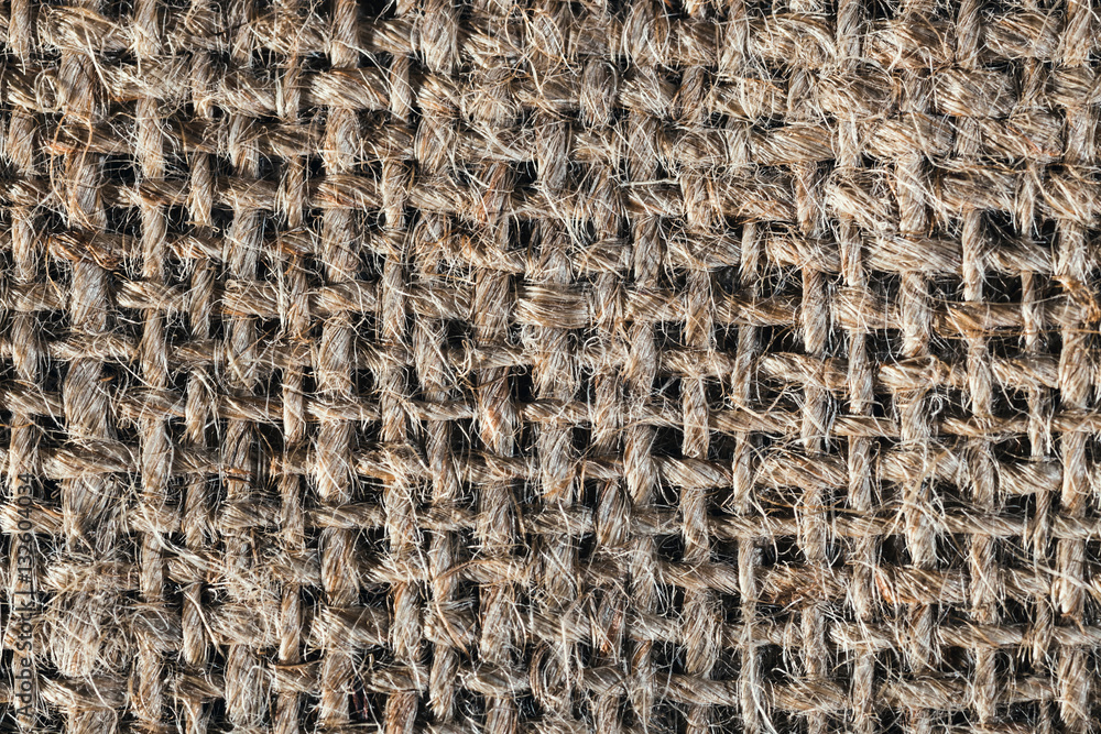 Textured background of a brown burlap bag, close up Textured background of a brown burlap bag, close up