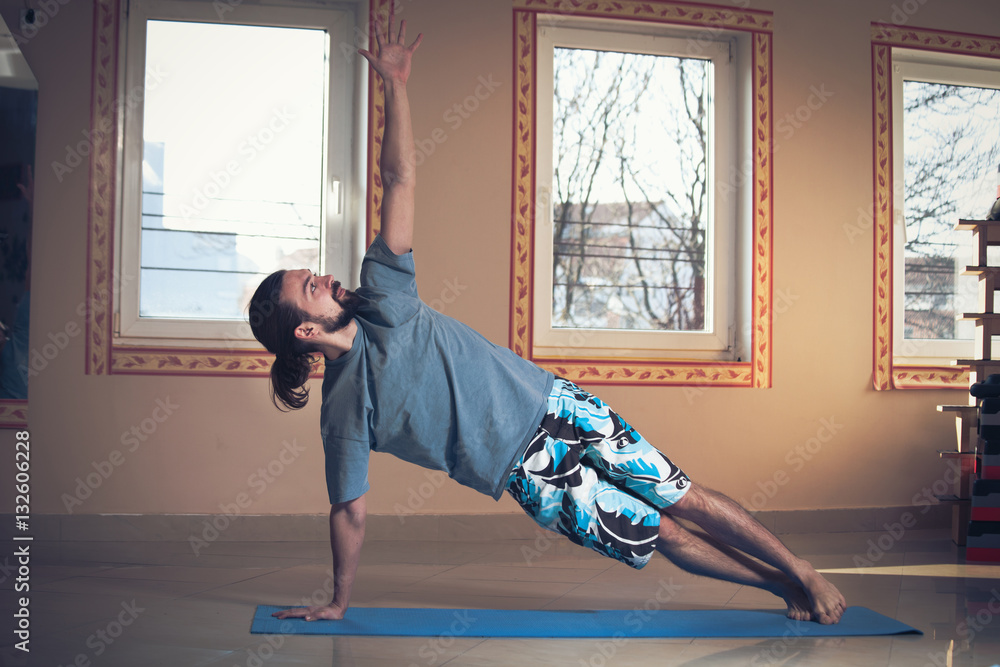 young man doing yoga  indoor