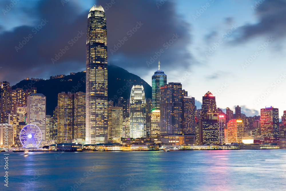 Fototapeta premium Hong Kong office building night lights over Victoria bay