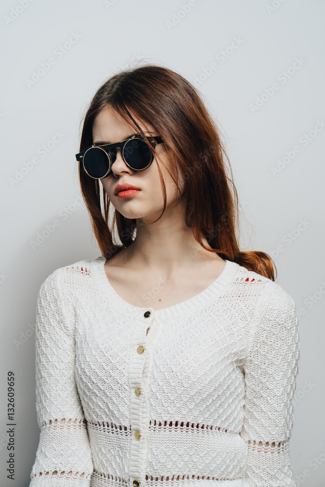 confident woman with glasses, emotions, gray background, light jacket confident woman with glasses, emotions, gray background, light jacket