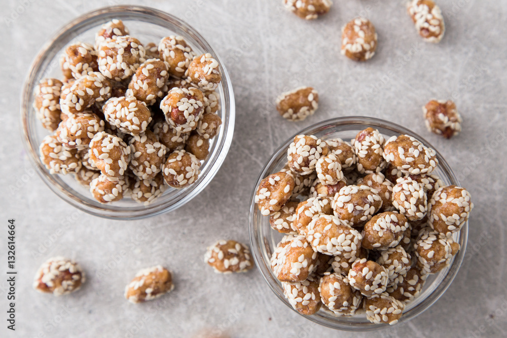 Caramel Coated Peanut with Sesame on Stone Background Caramel Coated Peanut with Sesame on Stone Background